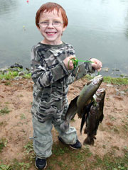 boy fishing at camping resort